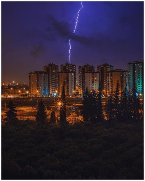 Captivating cityscape illuminated by lightning, sh