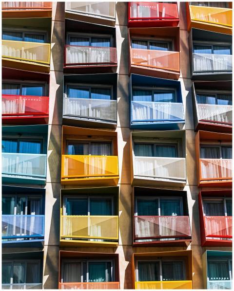 Vibrant facade of a modern apartment building feat