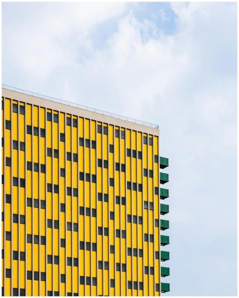 Bright modern building facade with geometric patte