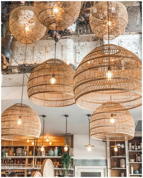 Stylish wicker pendant lights enhancing the ambian