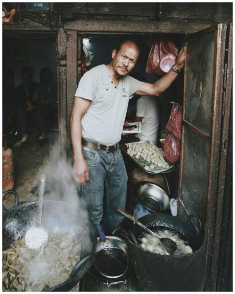 Asian street vendor cooking traditional food outdo