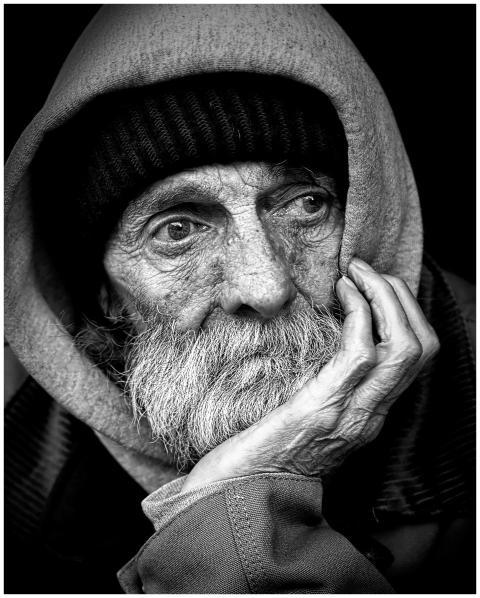 Black and white portrait of an elderly man with a