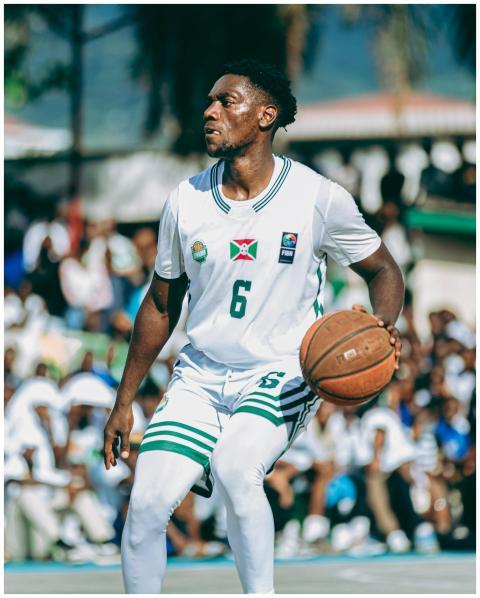 Focused athlete dribbling basketball on an outdoor