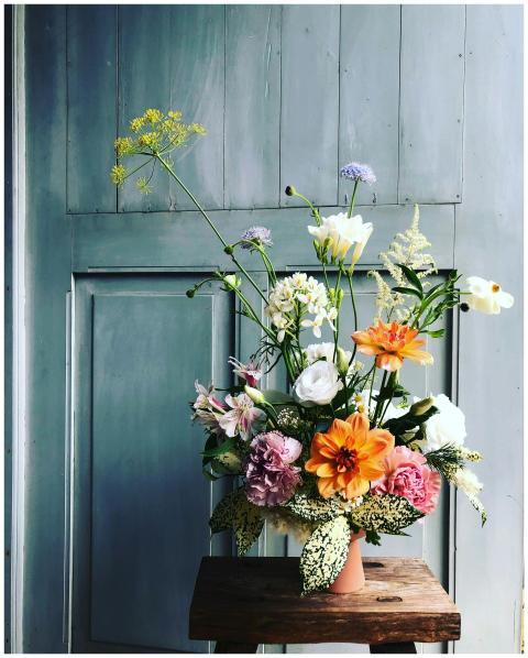 A vibrant floral bouquet in a vase displayed on a