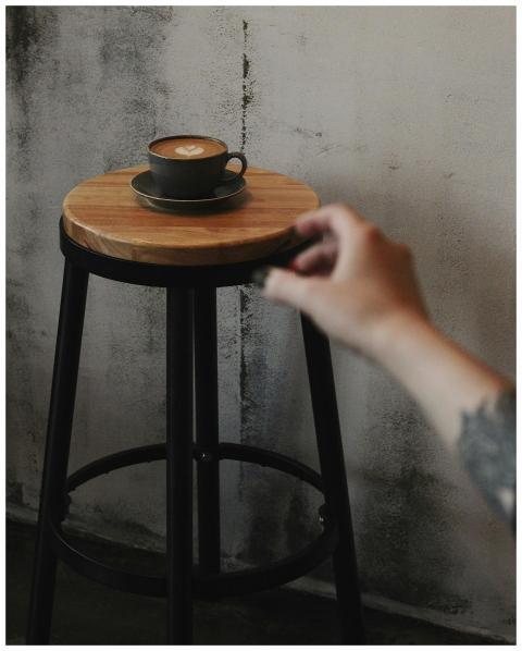 Captivating latte art displayed on a rustic wooden