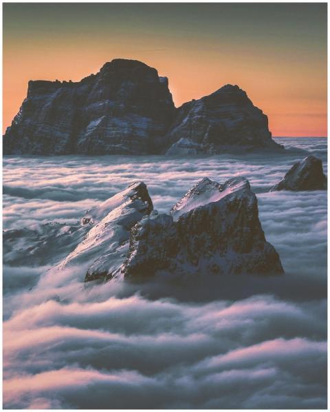 Captivating view of mountain peaks emerging throug