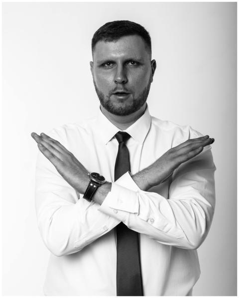 Black and white portrait of a businessman crossing