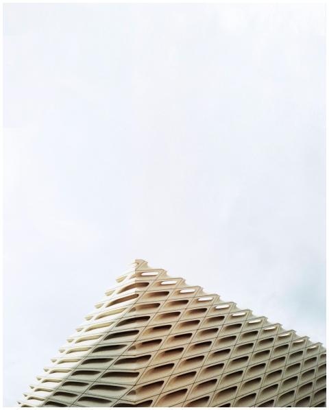 Minimalist rooftop design against bright sky in Lo