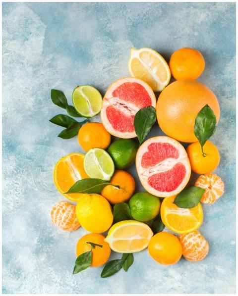 Colorful assortment of fresh citrus fruits includi