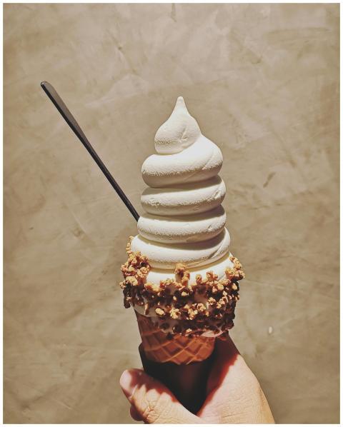 Close-up of a vanilla ice cream cone with textured