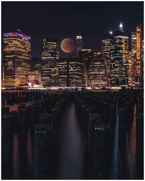 Dramatic night view of New York skyline with illum