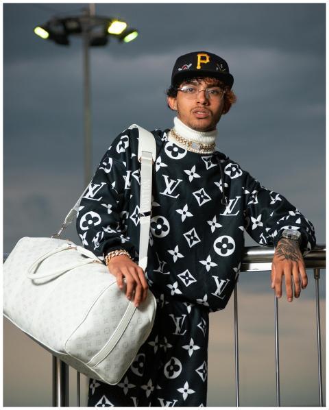 Stylish young man in luxury Louis Vuitton outfit i