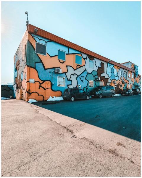 Vibrant graffiti on urban building exterior with p