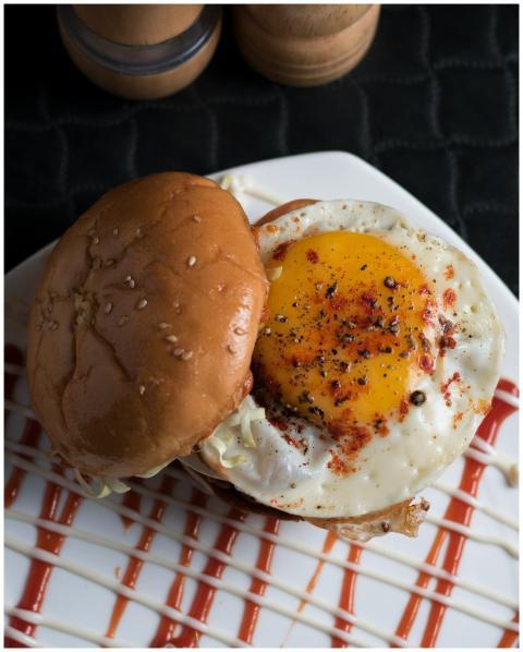 Close-up of a tasty egg burger with sesame bun, se