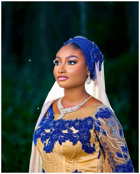 Portrait of a woman in traditional blue and gold a