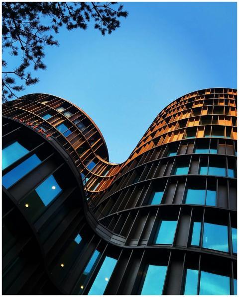 Stunning low-angle shot of a modern curved glass a