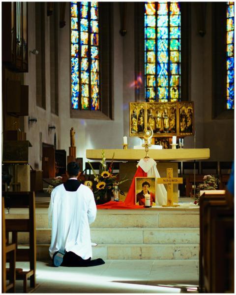 Priest Kneeling Historic Church