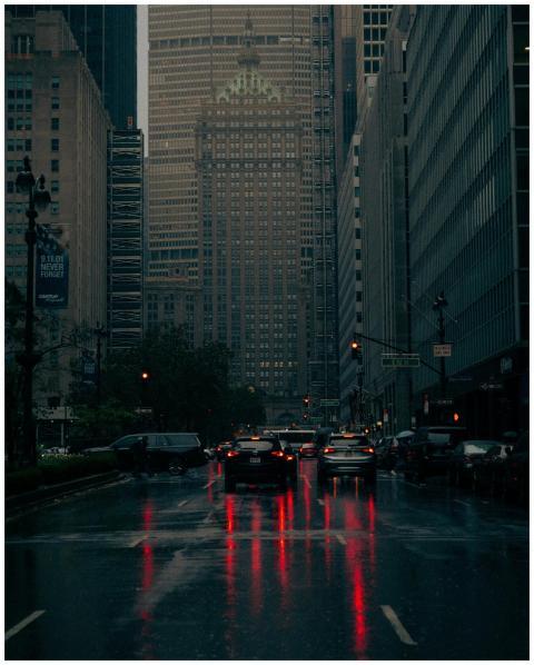 Nighttime view of a rainy street in New York City,