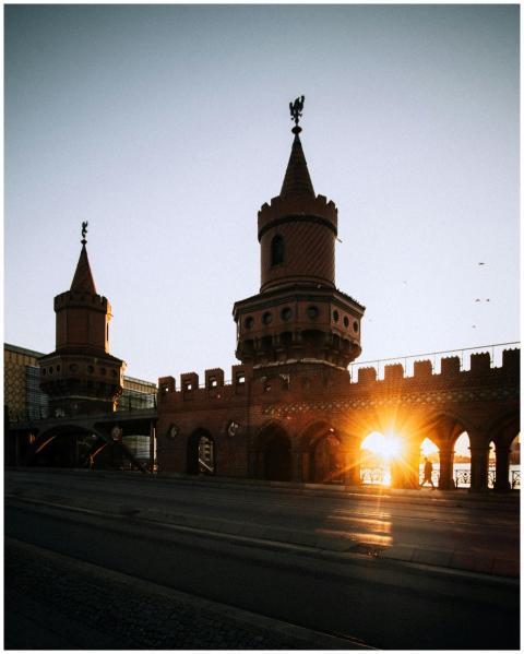 Sunset over Oberbaum Bridge in Berlin with its ico