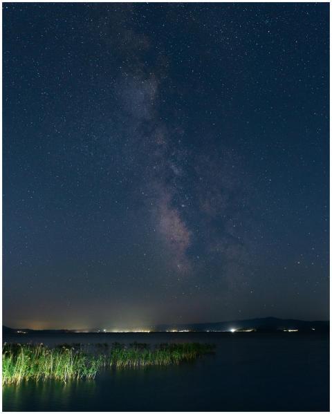 Starry night sky showcasing the Milky Way over a c