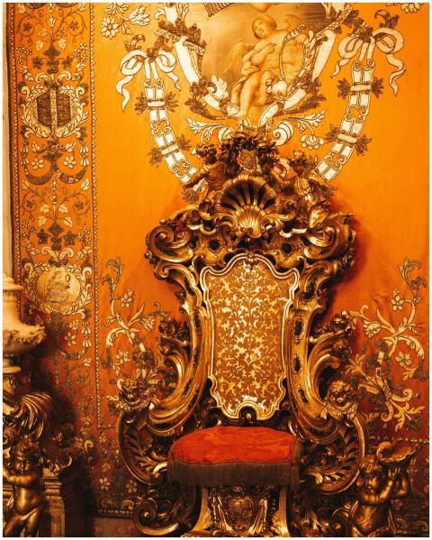 A richly decorated Baroque throne in vibrant golde