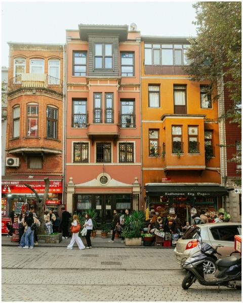 Lively street with colorful architecture, shops, a
