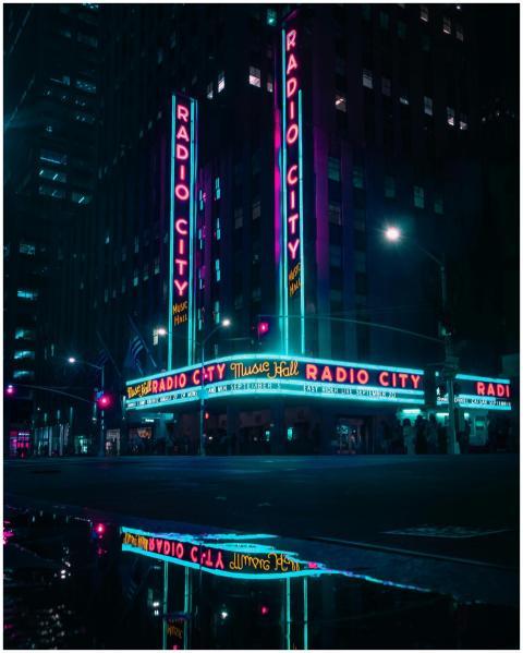 Vibrant nighttime view of Radio City Music Hall wi