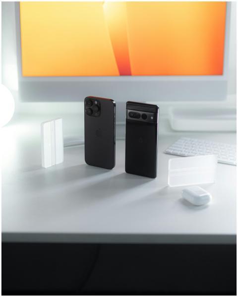 A sleek display of two smartphones against a glowi