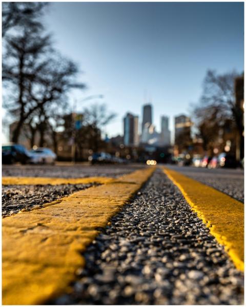 Dramatic low-angle shot of an urban street with bl