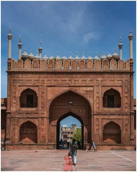 Vertical shot of a woman walking towards the iconi