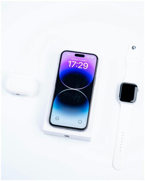 Close-up view of smartphone, smartwatch, and earph