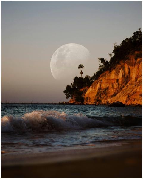 A serene beach scene with waves crashing against t
