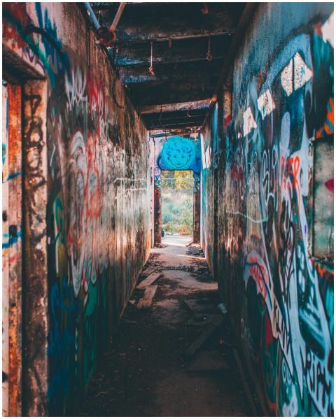 Vivid street art covers walls of an abandoned indu