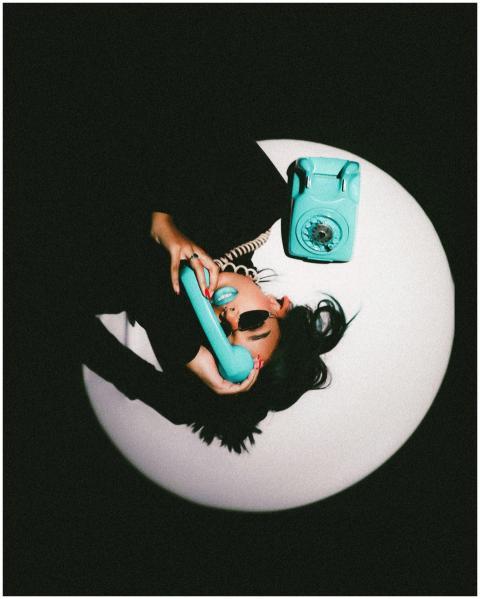 Modern portrait of a young woman with a rotary pho