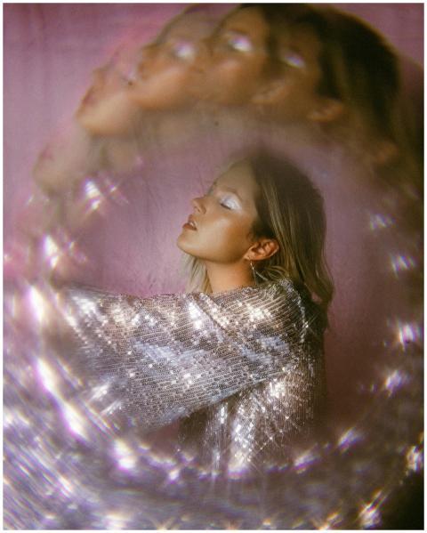 Artistic portrait of a woman with shimmering silve