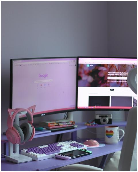 Stylish home office desk setup with dual monitors,