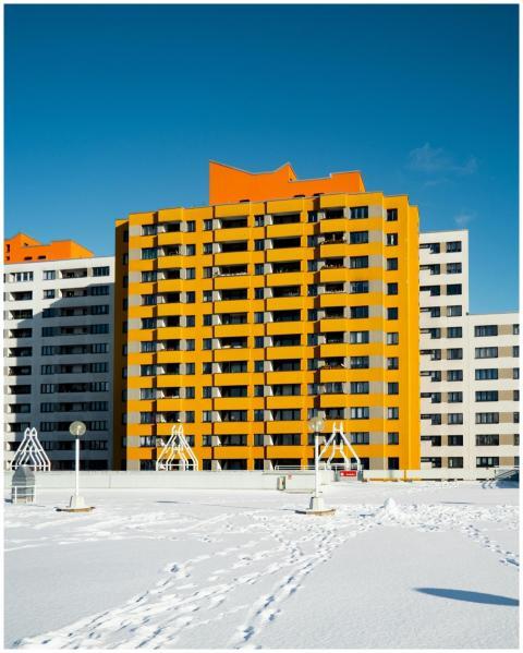 Colorful high-rise buildings in Berlin with snow o