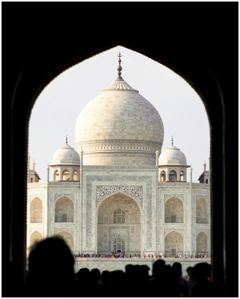 A stunning view of the Taj Mahal framed by an arch