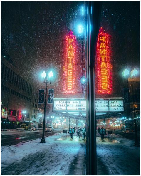 Snowy winter night scene at Pantages Theater with