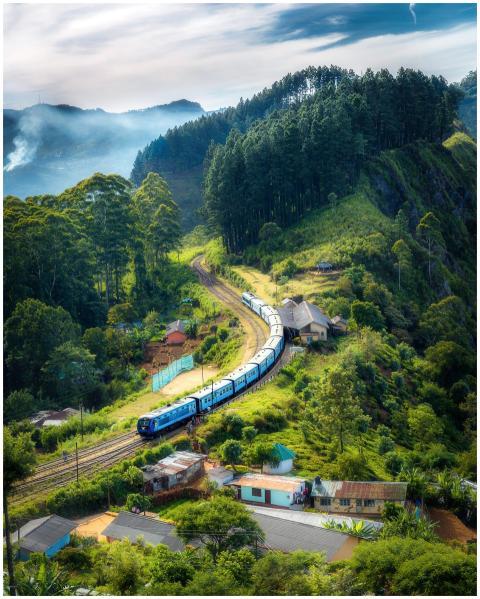Aerial view of a picturesque train winding through