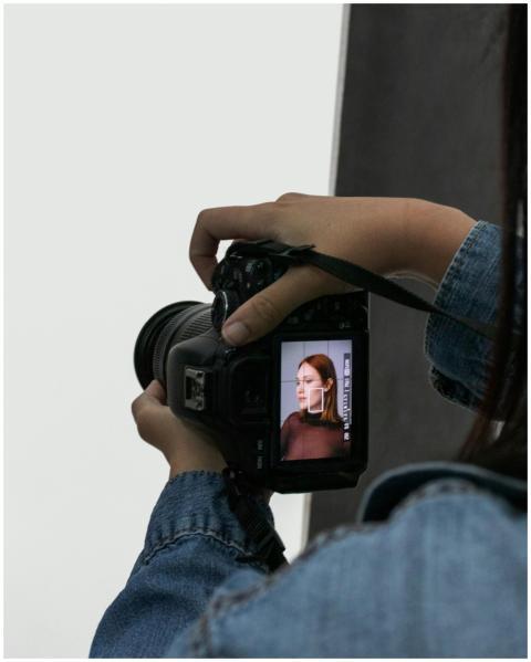 Close-up of a photographer taking a portrait in a