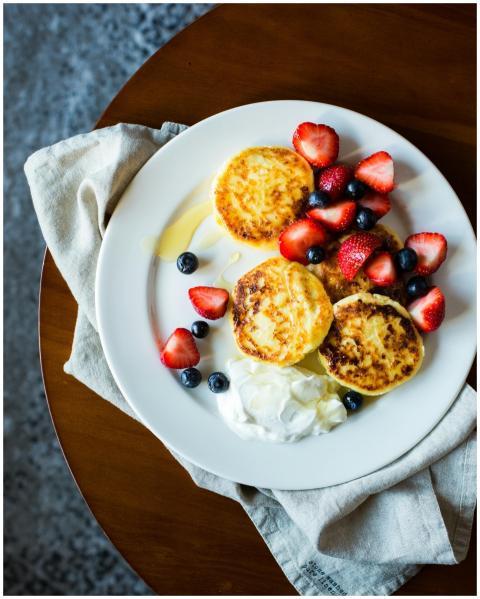 Top view of pancakes with strawberries and blueber