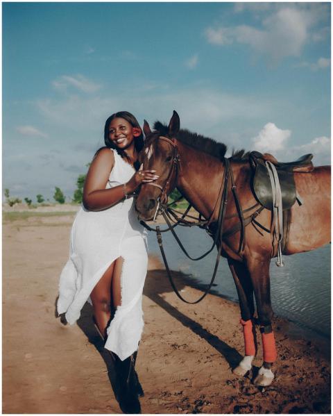 A joyful moment shared between a woman and her hor
