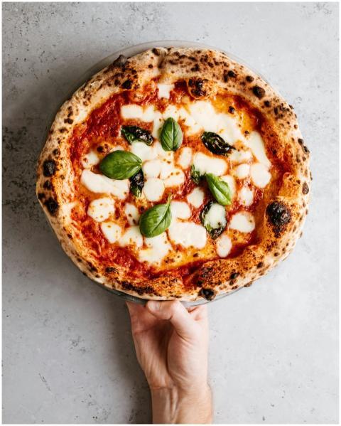 Close-up of a fresh Margherita pizza with mozzarel