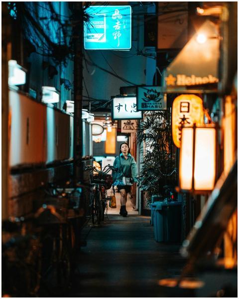 Explore a lively Osaka alley at night featuring ne