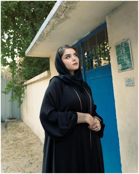 Elegant woman in traditional clothing standing out