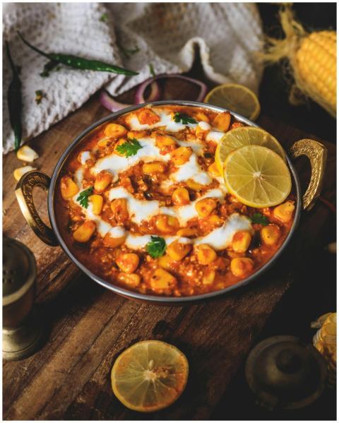 A mouth-watering Indian curry with lemon slices, p