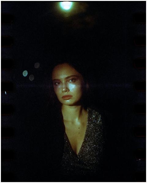 Captivating night portrait of a woman in a sparkli