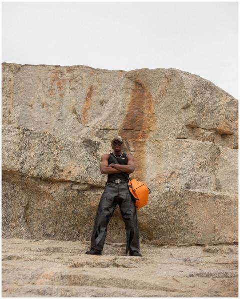 Adventurous Hiker Standing Against