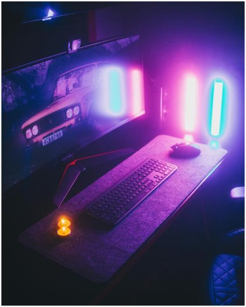 Stylish computer desk setup illuminated with vibra